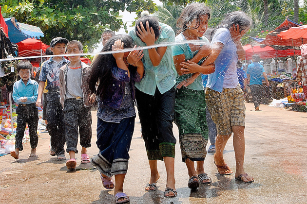 - Girls are being splashed during Laos New Year Pi Mai - ກົດສະຫລອງປີໃໝ່ຈົ່ງຮ່ວມໃຈກັນປະຕິບັດ - Girls are being splashed during Laos New Year Pi Mai - ກົດສະຫລອງປີໃໝ່ຈົ່ງຮ່ວມໃຈກັນປະຕິບັດ